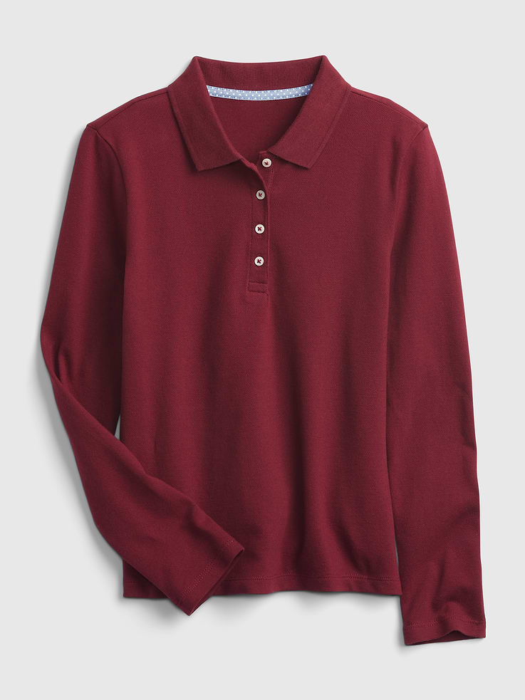 Image 1 of 1, Same dress code. All new fits. Inspired by their weekend favorites — remixed for school days., Soft woven knit uniform polo shirt., Spread collar, buttons at front., Long sleeves., Made with 97% organically grown cotton. Organic cotton is better for people and the environment because it's grown without the use of harmful synthetic pesticides and fertilizers., This product was made in a factory that invests in gender equality and women’s empowerment. Through RISE (Reimagining Industry to Support Equality) and Gap Inc.’s program P.A.C.E. (Personal Advancement & Career Enhancement), we support people who make our clothes to build the skills, knowledge, confidence, and resilience needed to advance in work and life. Learn more here ., Product #752071
