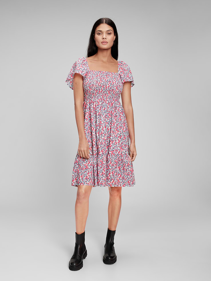 Image 1 of 1, Smooth weave., Short puff sleeves with elasticized at shoulders., Square neckline., Smocking at yoke., Shirring at empire waist and skirt tier., Select styles have allover print, plaid, or swiss dot., Product #827806