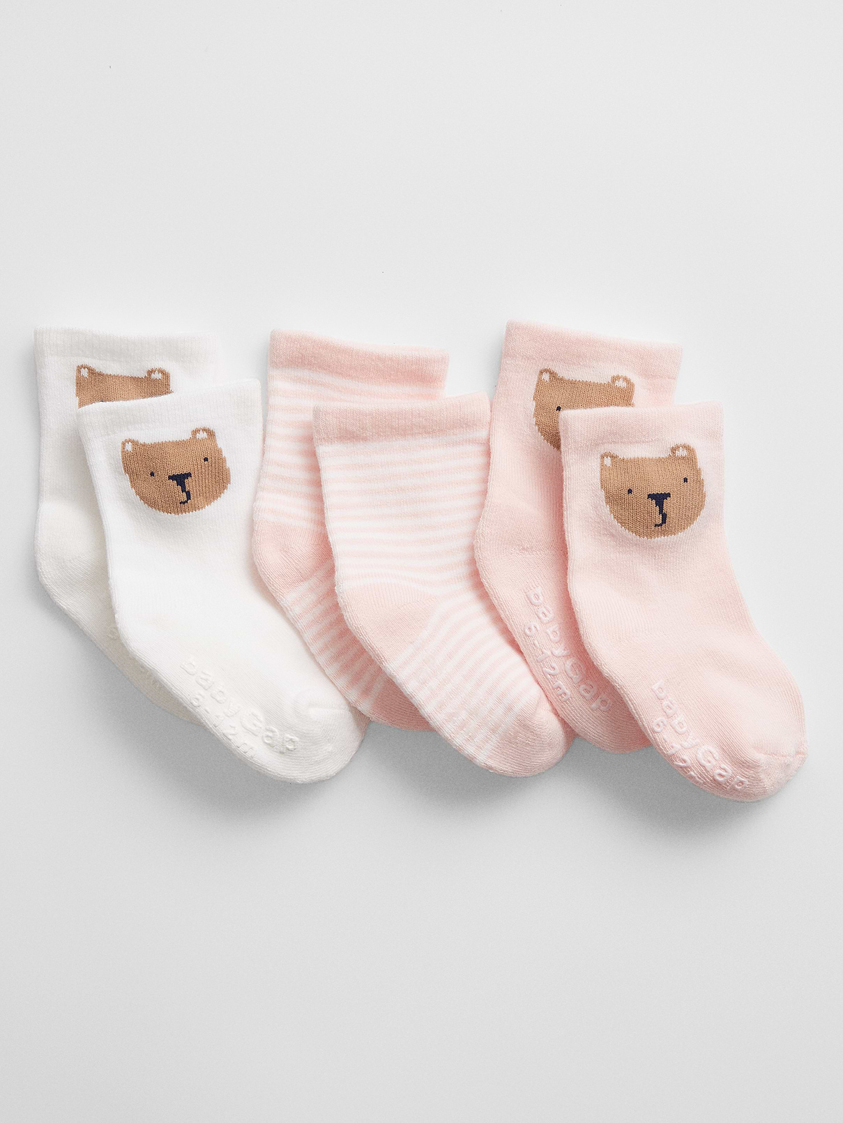 Image 1 of 1, Supersoft and cozy baby essentials featuring our signature Brannan Bear., Soft stretch knit., Ribbing at top., Reinforced toe and heel., Gripper logo at sole helps provide traction., Select styles have allover stripes, or Brannan Bear graphic., This product was made in a factory that invests in gender equity and women’s empowerment through RISE. Learn more at, Product #517044