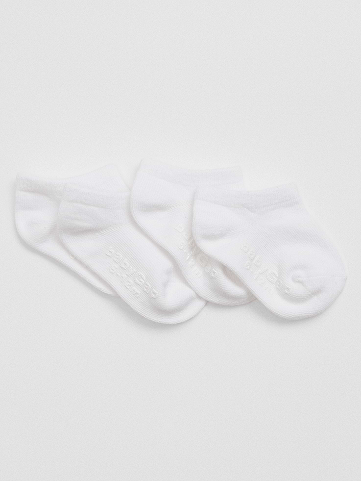 Image 1 of 1, Made with 10% recycled contents., Soft stretch knit., Ribbing at top., Reinforced toe and heel., Gripper logo at sole helps provide traction., This product was made in a factory that invests in gender equity and women’s empowerment through RISE. Learn more at, Product #840671