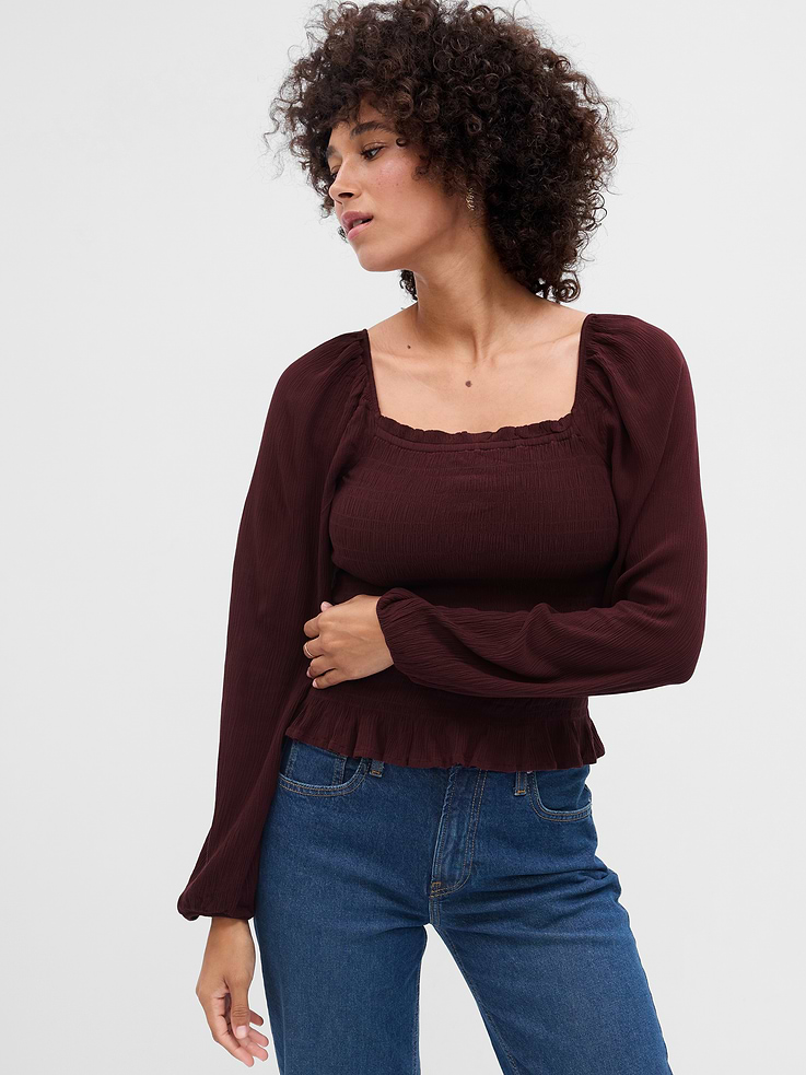 Image 1 of 6, Smooth crepe weave., Long sleeves with elasticized shoulders and cuffs., Ruffle trim at elasticized square neckline., Smocking at yoke and back., Shirring at hem., Product #770200