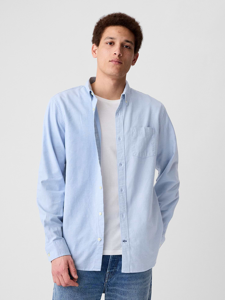 Image 1 of 4, Smooth oxford weave., Long sleeves with button cuffs., Button-down collar, button front., Patch pocket at chest., Curved shirttail hem is longer at back., Select styles have allover print, stripes, or plaid., This product was made in a factory that invests in gender equity and women’s empowerment through RISE. Learn more at, Product #608574