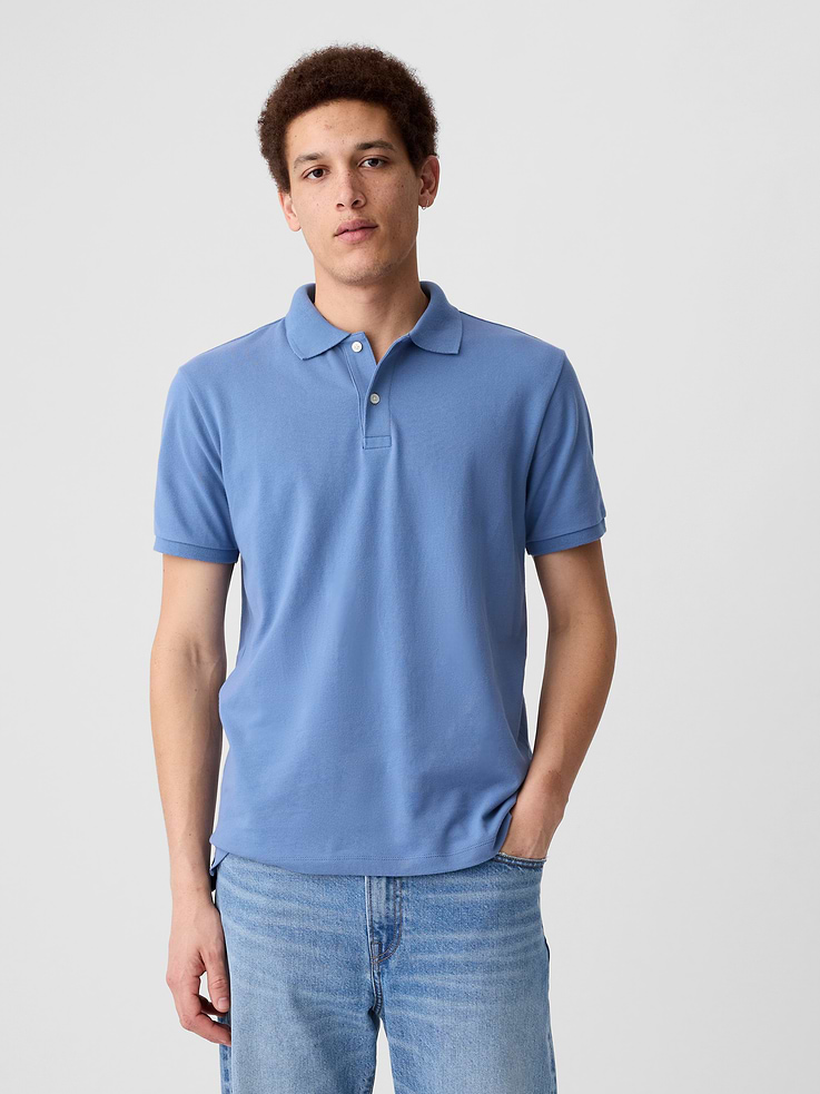 Image 1 of 4, Stretch pique knit., Short sleeves., Spread collar, henley button front., Slits at hem., Note: The dye used in the crafting of this product is prone to crocking, or color transfer. Please avoid contact with light-colored fabric or upholstery., This product was made in a factory that invests in gender equity and women’s empowerment through RISE. Learn more at, Product #547250