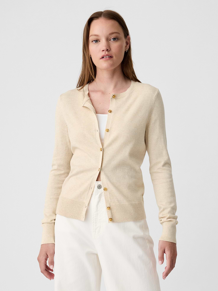 Image 1 of 6, Soft cotton knit., Long sleeves with ribbed, banded cuffs., Ribbed crewneck, button front., Ribbed, banded hem., Note: The dye used in the crafting of this product is prone to crocking, or color transfer. Please avoid contact with light-colored fabric or upholstery., This product was made in a factory that invests in gender equity and women’s empowerment through RISE. Learn more at, Product #435664