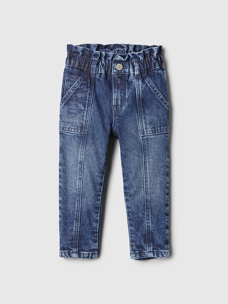 Image 1 of 2, Mom’s favorite denim, now made mini. These comfy-cute fits are made to wear on the daily., Low stretch denim jeans., Button closure and zip fly at elastic, ruffled waist., 5-pocket styling., Seams at front., Made with 99% organically grown cotton, which is grown without the use of synthetic pesticides and fertilizers., Responsibly Made: This pair of jeans is part of our water-saving Washwell program. Compared with conventional wash methods, Washwell uses at least 20% less water and has saved over a billion liters of water since 2016., This product was made in a factory that invests in gender equality and women’s empowerment. Through RISE (Reimagining Industry to Support Equality) and Gap Inc.’s program P.A.C.E. (Personal Advancement & Career Enhancement), we support people who make our clothes to build the skills, knowledge, confidence, and resilience needed to advance in work and life. Learn more here ., Product #525922