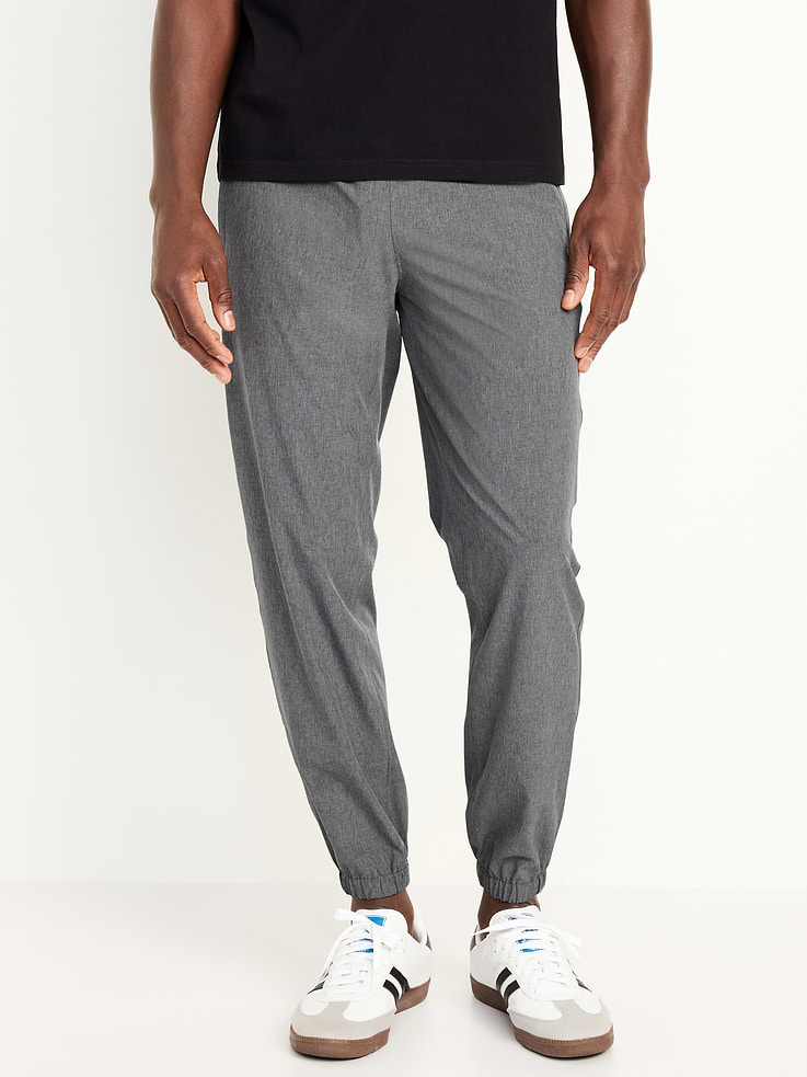 Image 1 of 4, Make your moves in Old Navy Sport's StretchTech: A lightweight, quick-drying fabric with high-performance stretch., elastic-drawstring waist, hip pockets, elastic cuffs, quick drying, breathable, 4-way stretch, Product #506915