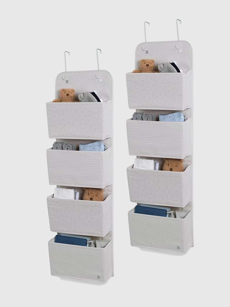 Image 1 of 3, This babyGap by Delta Children 2 Pack of Over the Door Storage Organizers is the perfect solution for organizing any nursery or child’s bedroom., The organizers feature an adorable polka dot motif, striped pattern and embroidered Brannan Bear for an elevated and uniquely babyGap look., Easy to hang and use, the organizers can be hung over the door with the provided universal hooks that work for most doors., Set of 2 organizers with 4 spacious pockets each provides plenty of storage space for diapers, clothing, toys, etc., Made of durable canvas. All 4 compartments have 3-sided support to keep the perfect shape when in use.