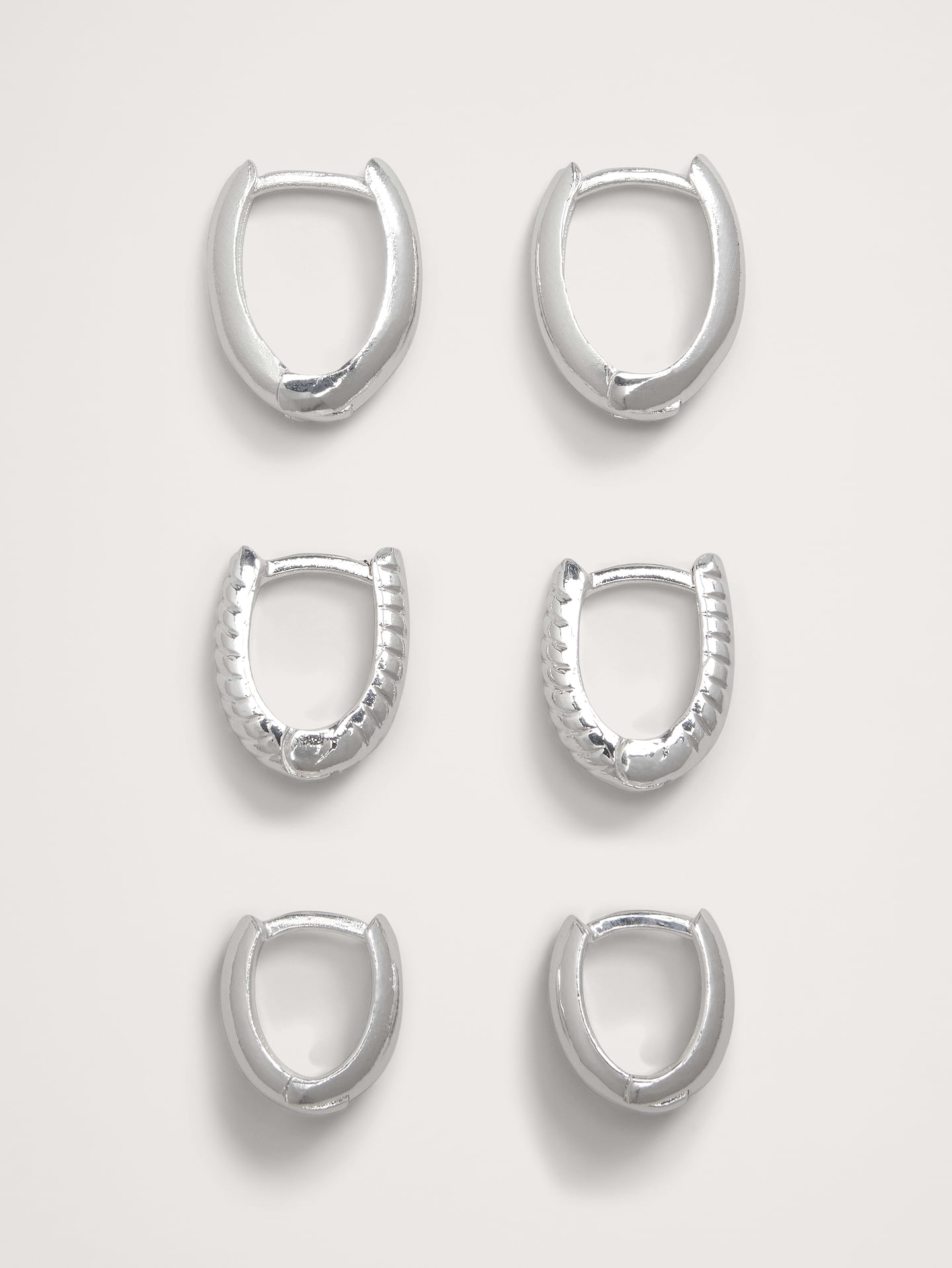 Image number 1 showing, Ravena Oval Huggie Hoop Earrings Set Of 3 by Aureus + Argent