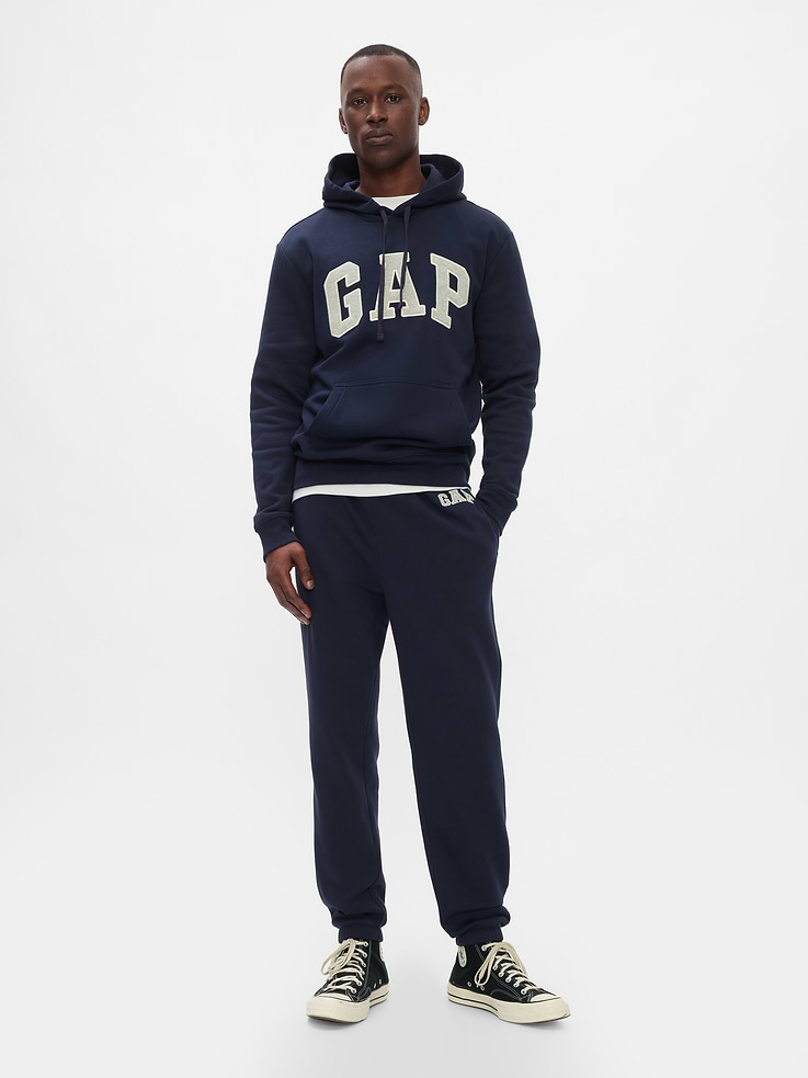 Image 1 of 4, Soft, comfy fleece., Drawcord ties at elasticized waistband., Gap logo at hip., On-seam pockets, patch pocket at back., Elasticized cuffs., This product was made in a factory that invests in gender equity and women’s empowerment through RISE. Learn more at gapinc.com/equity., Product #659229