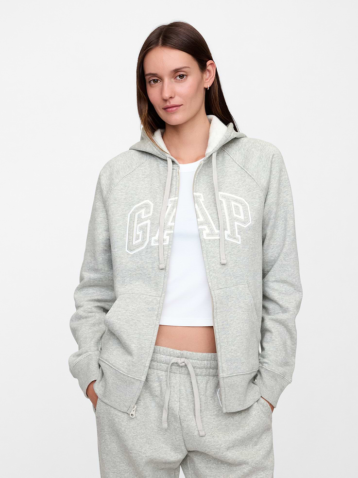 Image 1 of 5, Now even softer with a more relaxed fit., Made with 9% recycled contents., Soft, comfy fleece., Long raglan sleeves with banded cuffs., Drawcord ties at hood, zip front., Embroidered Gap logo at front., Kanga pockets., Banded hem., Product #870256