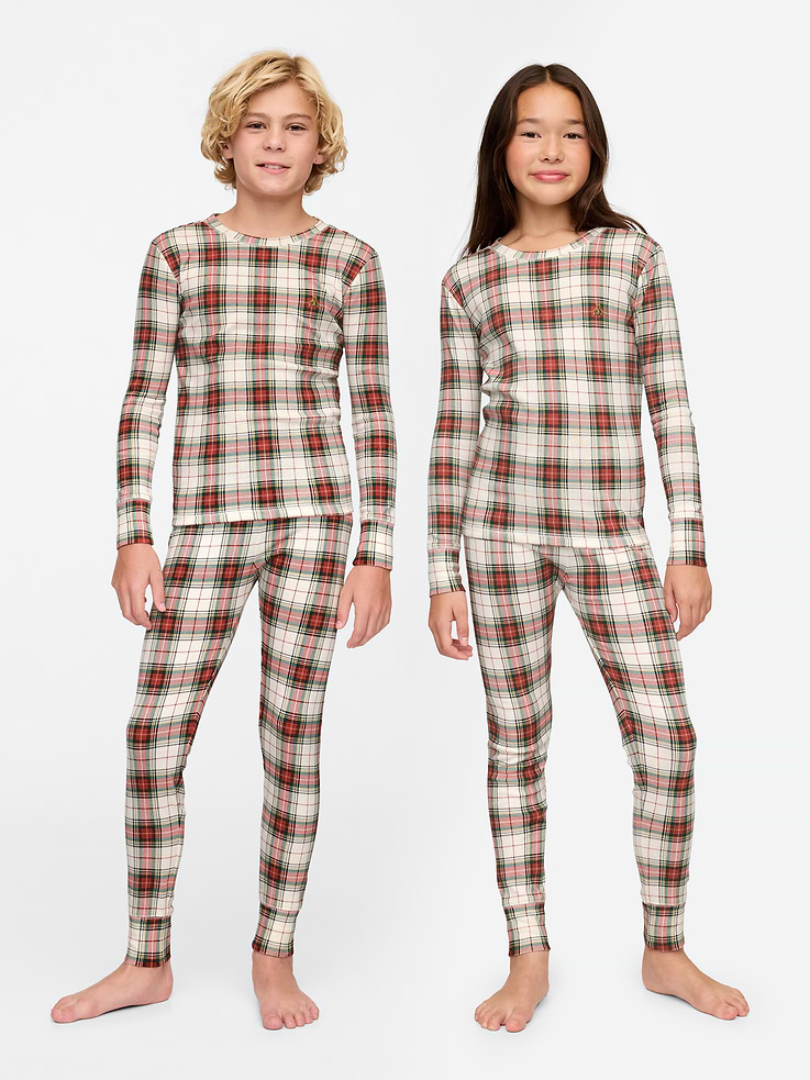 Image 1 of 6, Our comfiest PJs—now softer than ever. Cozy brushed cotton on the inside. All their favorite prints & colors on the outside., Soft organic cotton pajama top and pants set with a cozy brushed interior., Crewneck., Long sleeves., Elasticized waist at PJ pants., Allover plaid., Made with 100% organically grown cotton, which is grown without the use of synthetic pesticides and fertilizers., This product was made in a factory that runs the Gap Inc. P.A.C.E. (Personal Advancement & Career Enhancement) program. P.A.C.E. is our educational program that helps the women who make our clothes build the skills, knowledge, confidence & resilience needed to advance in work & life. Learn more here ., Product #526014