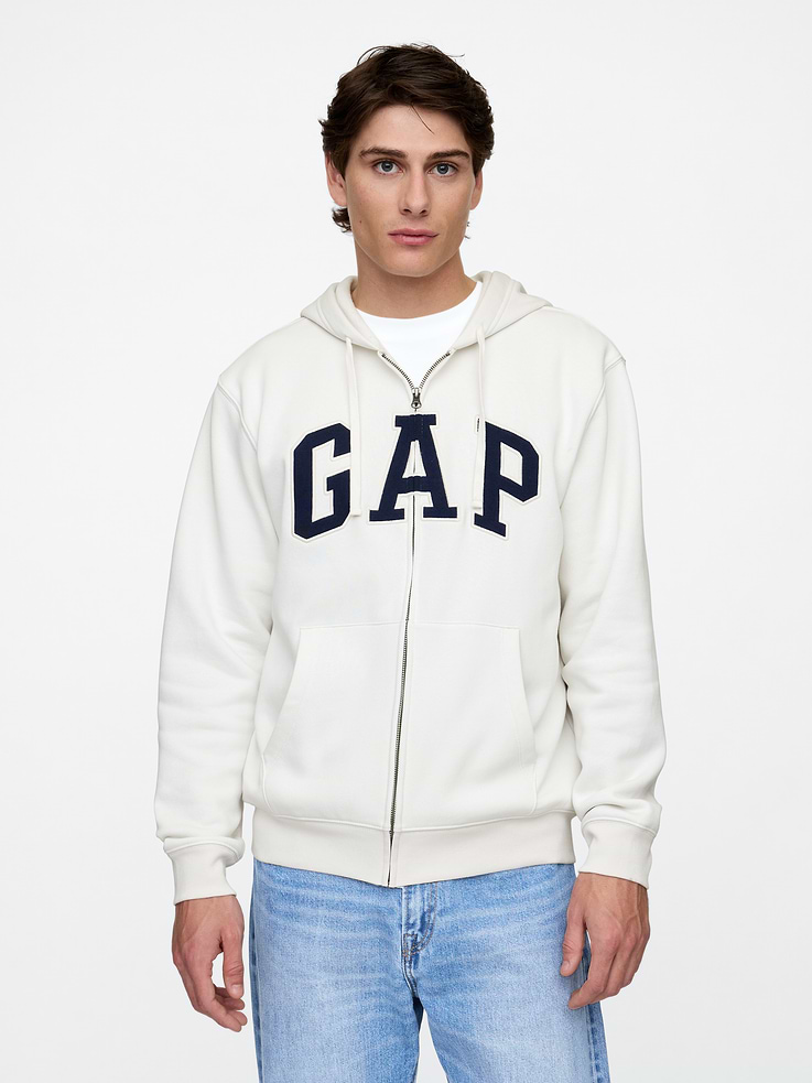 Image 1 of 7, Soft, comfy fleece., Dropped shoulder, long sleeves with banded cuffs., Drawcord ties at hood, zip front., Gap logo at front., Kanga pockets., Banded hem., This product was made in a factory that invests in gender equity and women’s empowerment through RISE. Learn more at, Product #683050