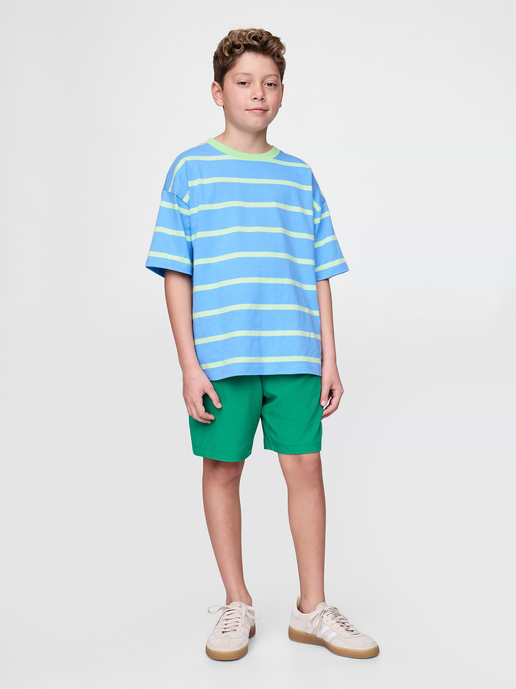 Image 1 of 5, Wet to dry. Pool to play. Quick-dry shorts go wherever their day takes them., Stretchy, quick-dry knit shorts., Drawstring at elasticized waist., Front slant pockets, back zip pocket., These shorts have a mesh liner for added durability., Made with 89% recycled polyester. Compared to virgin materials, using recycled materials helps to reduce resource use and waste., Made with moisture-wicking fabric. Stretchy, soft, and loaded with cool details. Some novelty prints do not feature moisture-wicking fabric. See garment for details., This product was made in a factory that invests in gender equality and women’s empowerment. Through RISE (Reimagining Industry to Support Equality) and Gap Inc.’s program P.A.C.E. (Personal Advancement & Career Enhancement), we support people who make our clothes to build the skills, knowledge, confidence, and resilience needed to advance in work and life. Learn more here ., Product #724566