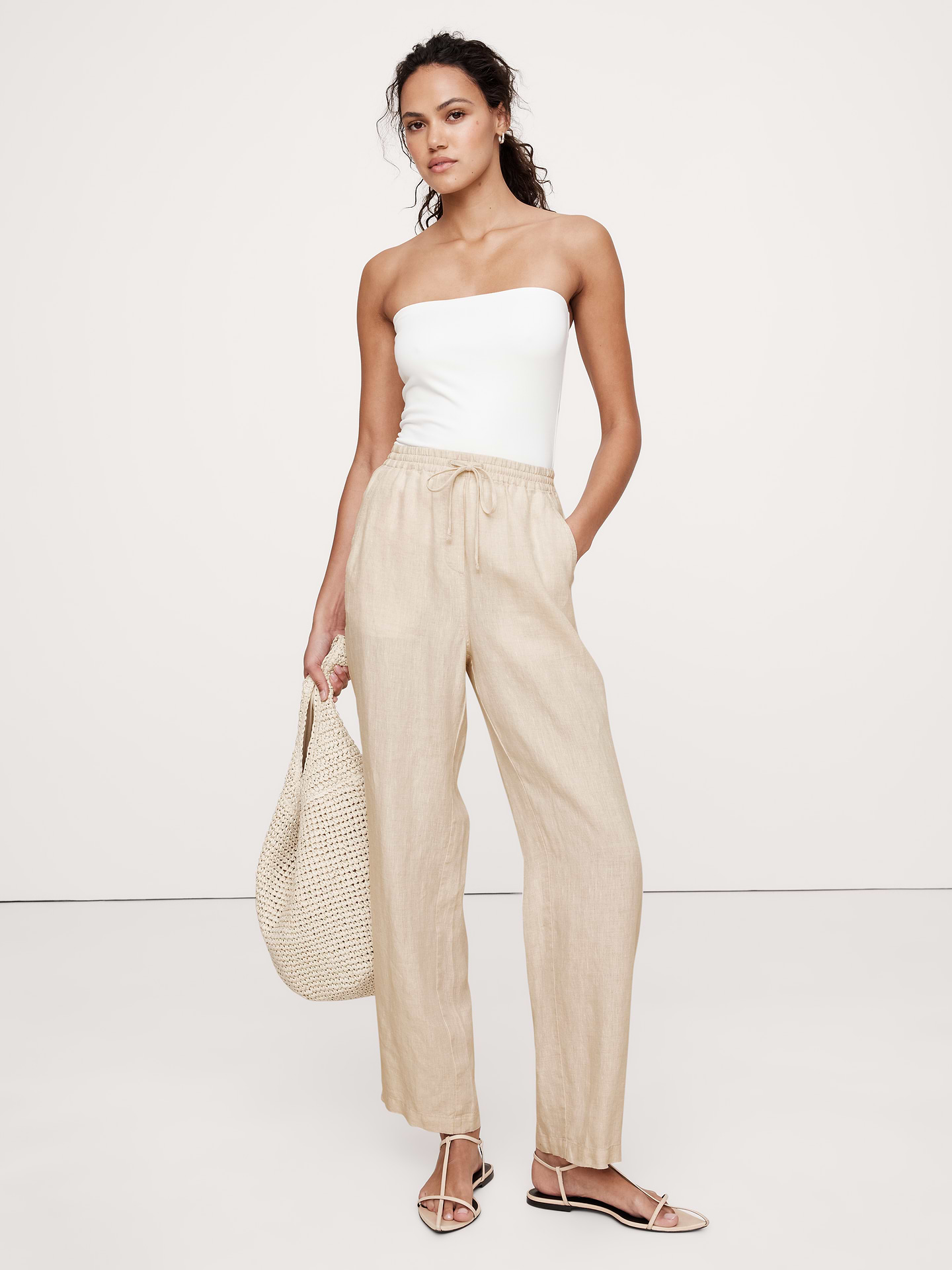 Image 1 of 4, The vibe is vacation. We cut these easy pants in our favorite 100% certified-European linen., Relaxed fit: High rise (12.5"). Relaxed through hip and thigh with a straight leg. Ankle length., Elastic waistband with drawstring closure., Side and back pockets., Unlined., *White is semi-sheer., Product #713472