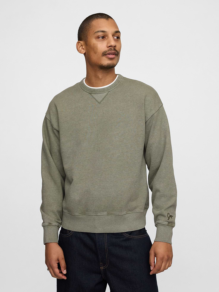 Image 1 of 5, Soft, heavyweight cotton-blend French terry sweatshirt., Crewneck., Long sleeves with drop shoulders and banded cuffs., Banded hem., Made with 14% recycled polyester. Compared to virgin materials, using recycled materials helps to reduce resource use and waste., This product was made in a factory that invests in gender equality and women’s empowerment. Through RISE (Reimagining Industry to Support Equality) and Gap Inc.’s program P.A.C.E. (Personal Advancement & Career Enhancement), we support people who make our clothes to build the skills, knowledge, confidence, and resilience needed to advance in work and life. Learn more here ., Product #726969