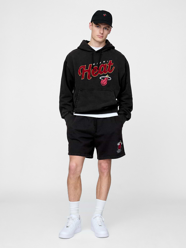 Image 1 of 9, We teamed up with the NBA to celebrate the league’s 75+ year history. Pairing iconic team logos with Gap classics. Made to celebrate the game, for the people who love it most., Soft heavyweight cotton-blend sweat shorts., Elasticized waist with drawcords., Front slant pockets., Miami Heat graphic at hem., This style has a specialized mineral wash, which provides a vintage, lived-in look., Made with 14% recycled polyester. Compared to virgin materials, using recycled materials helps reduce resource use and waste., Product #774238
