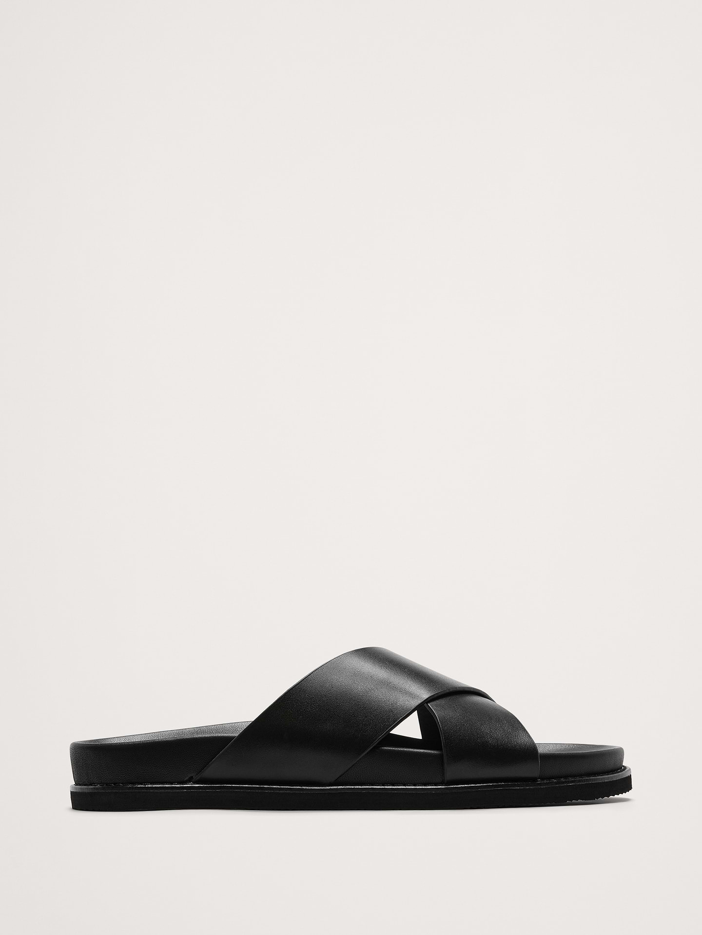 Image 1 of 1, A true slip-on sandal, these leather sandals have crossing straps and a molded leather footbed for comfort., Leather uppers and insole., Rubber soles., Product #710311