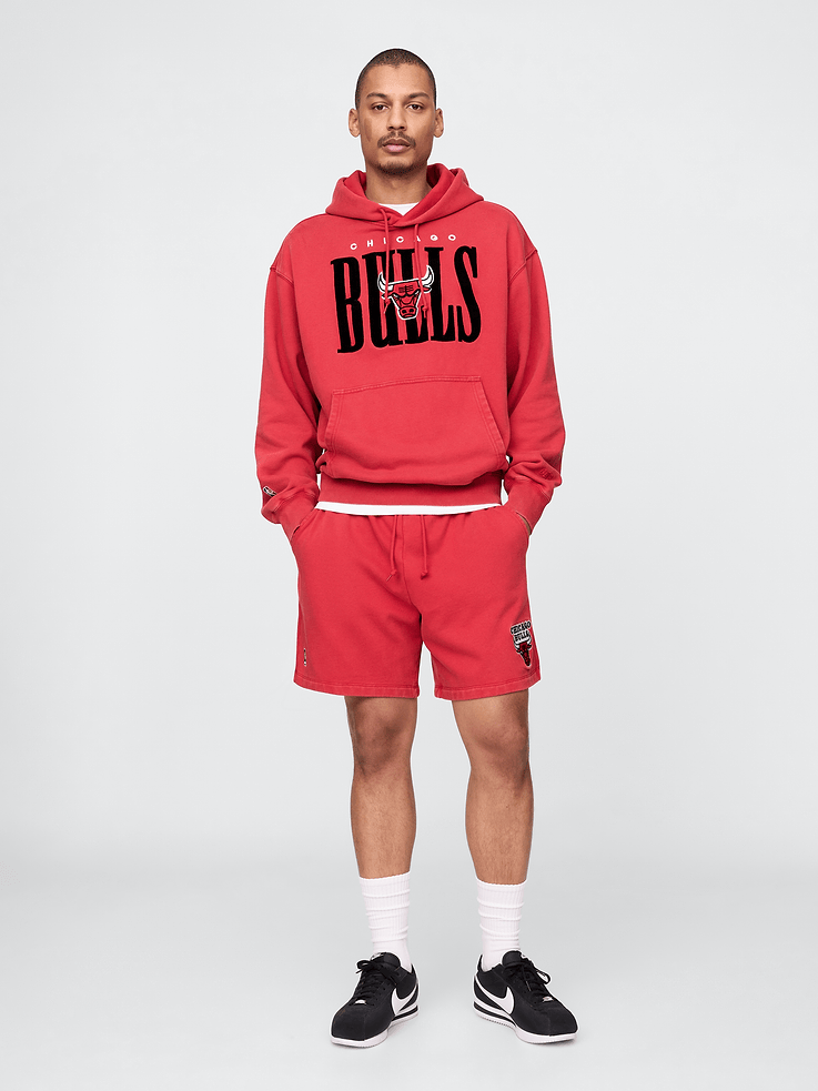 Image 1 of 8, We teamed up with the NBA to celebrate the league’s 75+ year history. Pairing iconic team logos with Gap classics. Made to celebrate the game, for the people who love it most., Soft heavyweight cotton-blend sweat shorts., Elasticized waist with drawcords., Front slant pockets., Chicago Bulls graphic at hem., This style has a specialized mineral wash, which provides a vintage, lived-in look., Made with 14% recycled polyester. Compared to virgin materials, using recycled materials helps reduce resource use and waste., Product #774222