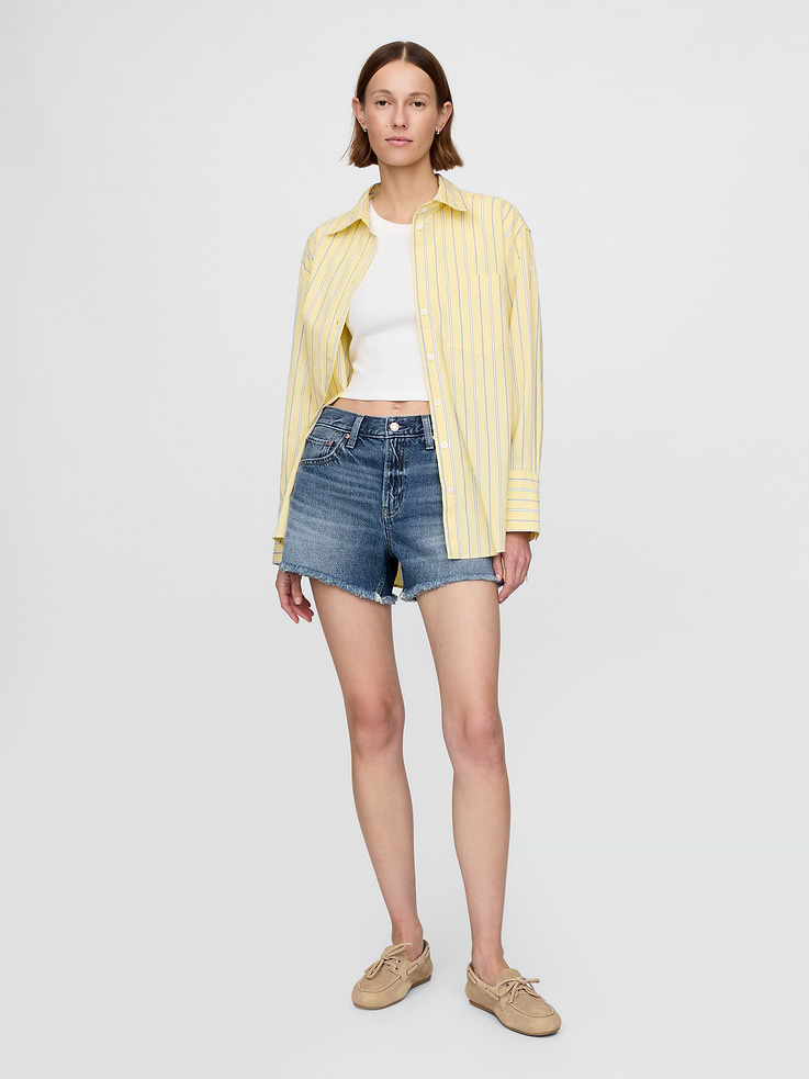 Image 1 of 8, The short of summer.Mid-rise with a laid-back fit.Supersoft with an authentic feel. In UltraSoft denim. Our exclusive, ultra-light Tencel™ blend with an easy drape for year-round wears., Fit: A supersoft, relaxed short that's easy through the hip and thigh with a cutoff hem., Fabric: 54% Cotton, 41% Tencel, 5% Recycled Cotton., Stretch: No Stretch Jeans. Authentic denim that gets better with every wear. Made to wear all day & break in over time.​, Look: A classic five-pocket denim short in a medium indigo wash., Details: Zip fly, five-pocket styling, & raw hem., Responsibly Made: This pair of shorts is part of our water-saving Washwell program. Compared with conventional wash methods, Washwell uses at least 20% less water., More Sustainable Cotton: Made with 5% recycled cotton. Compared to virgin materials, using recycled materials helps reduce resource use and waste., This product was made in a factory that invests in gender equality and women’s empowerment. Through RISE (Reimagining Industry to Support Equality) and Gap Inc.’s program P.A.C.E. (Personal Advancement & Career Enhancement), we support people who make our clothes to build the skills, knowledge, confidence, and resilience needed to advance in work and life. Learn more here ., Product #717957