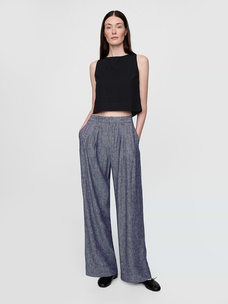 Image 1 of 8, Our soft-structured, effortless essential — now in a linen blend., Soft, heavyweight linen-blend pleated trousers., E-waist with concealed hook and bar closure, zip fly., Front slant pockets, back welt pockets., Certain styles have allover prints., This product was made in a factory that invests in gender equity and women’s empowerment through RISE. Learn more at gapinc.com/equity ., Product #713998