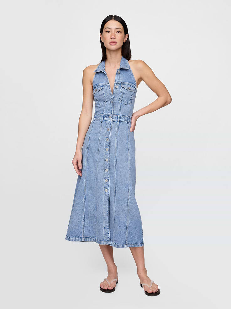 Image 1 of 5, A timeless standard. The icon to generations, passed down for generations., Authentic low-stretch denim midi dress., Point collar, button front., Halter neckline., Sleeveless., Button-flap patch pockets at chest., Elasticized back panel., Slit at front., Light wash., Responsibly Made: This denim dress is made with 5% recycled cotton and is part of our Washwell program, which uses at least 20% less water as compared with conventional wash methods. We’ve saved over a billion liters of water through Washwell since 2016., This product was made in a factory that invests in gender equality and women’s empowerment. Through RISE (Reimagining Industry to Support Equality) and Gap Inc.’s program P.A.C.E. (Personal Advancement & Career Enhancement), we support people who make our clothes to build the skills, knowledge, confidence, and resilience needed to advance in work and life. Learn more here ., Product #770585