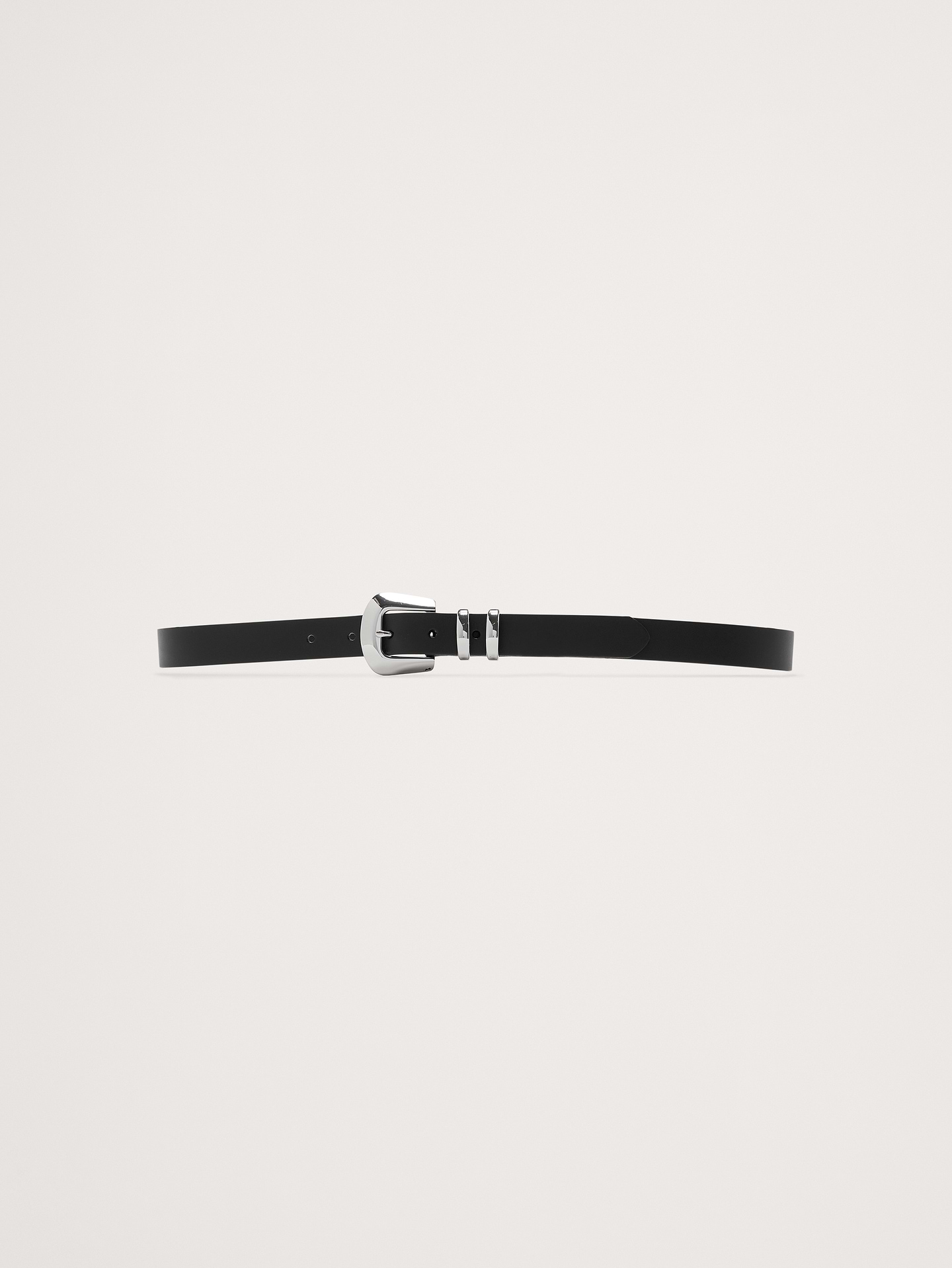 Image 1 of 1, Designed and fitted to be worn on the hips, this skinny-width belt is crafted from a sturdy cut of leather and secured with a single buckle with beveled edges., Single buckle closure., Designed to be worn at the hips., Product #782885