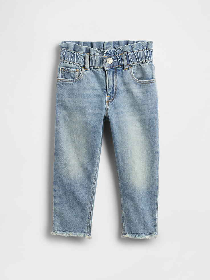 Image 1 of 3, Stretch denim., This jean is made with 5% recycled cotton. Less waste in the world. More great denim for you., Medium indigo wash., Elasticized ruffled waist., Button-closure, zip fly., Raw hem., Better denim. Better planet. This pair of denim is part of our water-saving Washwell™ program. Compared to conventional wash methods, Washwell™ has saved millions of liters of water since 2016., This product was made in a factory that invests in gender equality and women’s empowerment. Through RISE (Reimagining Industry to Support Equality) and Gap Inc.’s program P.A.C.E. (Personal Advancement & Career Enhancement), we support people who make our clothes to build the skills, knowledge, confidence, and resilience needed to advance in work and life. Learn more here ., Product #727226