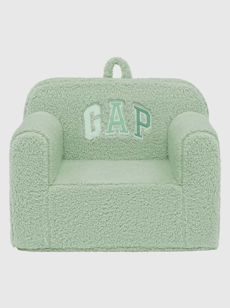 Image 1 of 6, Delight your little one with this babyGap by Delta Children Sherpa Chair., Kids will love reading, relaxing and cuddling in their very own chair, covered in plush sherpa and embellished with a Gap arch logo., Designed with a kid-friendly handle, your child can easily tote this chair around the house., A delightful addition to playrooms and nurseries, this chair is designed to for serious play, its removable and machine washable slipcover ensures it will look great for many years., This product is Greenguard Gold certified to meet stringent chemical emissions standards.