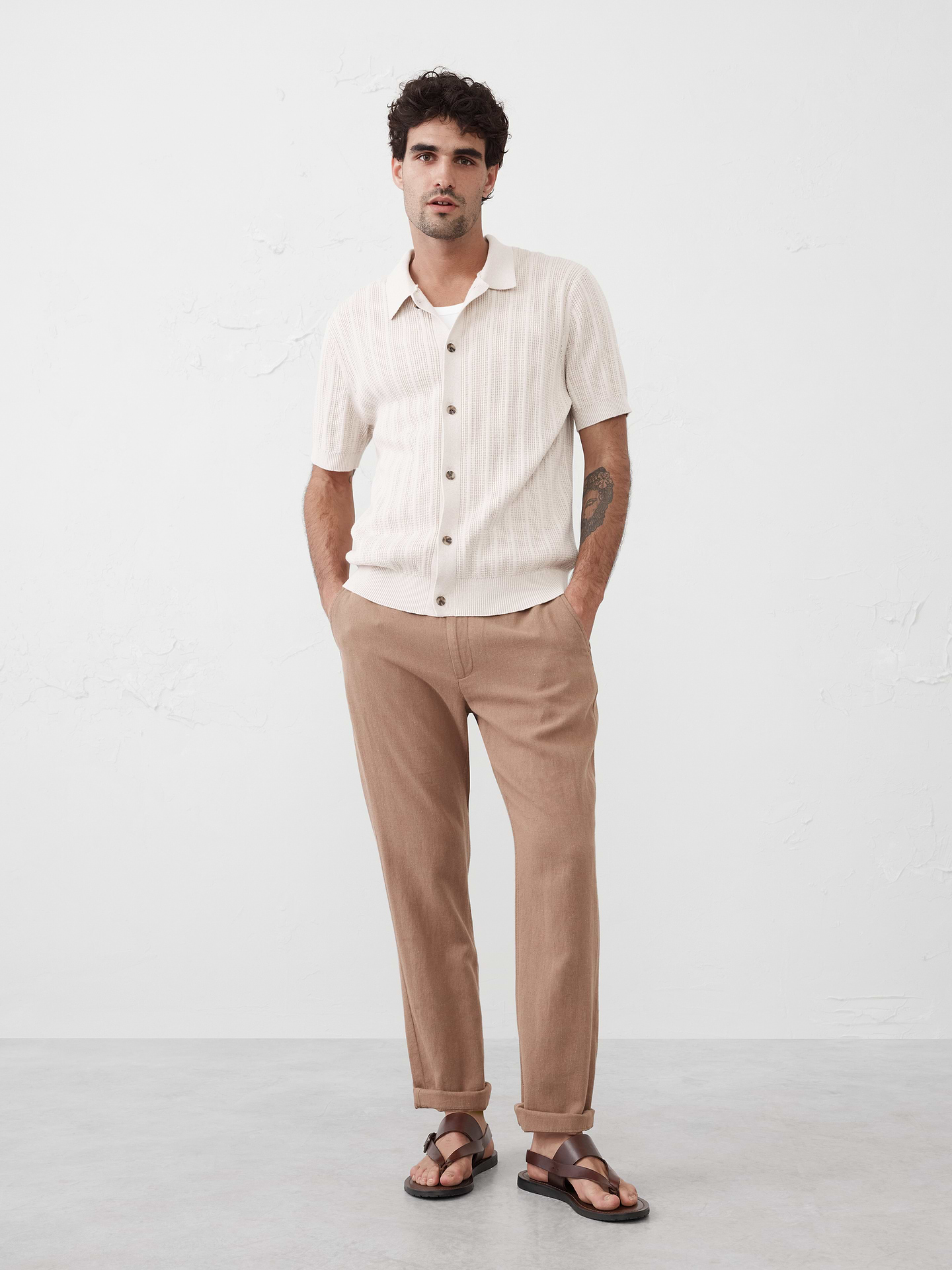 Image 1 of 7, Trendy sweater polo with vertical textured stripes., Polo collar. Short sleeves., Button front closure., Ribbed neck, arm cuffs and hem., Made exclusively for Banana Republic Factory., Product #748042