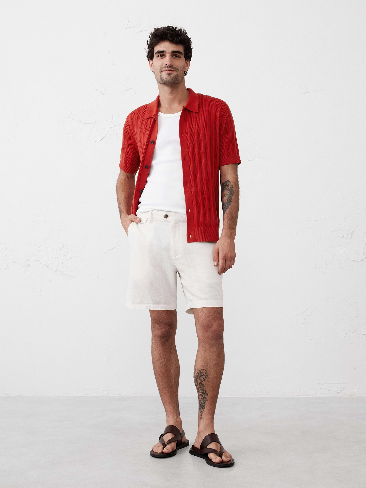 Image 1 of 7, Trendy sweater polo with vertical textured stripes., Polo collar. Short sleeves., Button front closure., Ribbed neck, arm cuffs and hem., Made exclusively for Banana Republic Factory., Product #748042