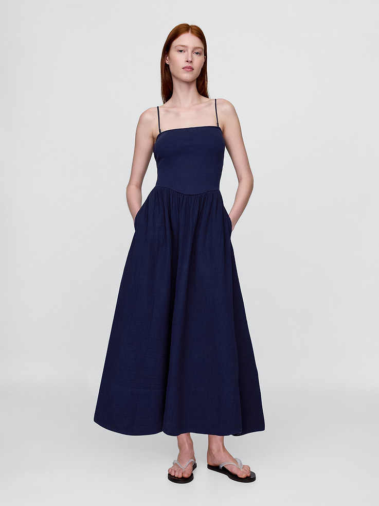 Image 1 of 7, Soft, heavyweight mixed media maxi dress with a knit top and cotton gauze skirt., Square neck, ribbed bodice., Removable spaghetti straps. Can be worn strapless., Shelf bra., Elasticized waist., Side pockets., This product was made in a factory that invests in gender equality and women’s empowerment. Through RISE (Reimagining Industry to Support Equality) and Gap Inc.’s program P.A.C.E. (Personal Advancement & Career Enhancement), we support people who make our clothes to build the skills, knowledge, confidence, and resilience needed to advance in work and life. Learn more here ., Product #734069
