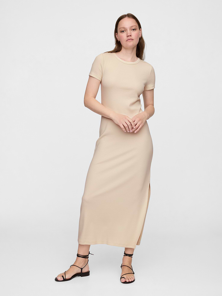 Image 1 of 6, Soft ribbed knit., Short sleeves., Crewneck., Slits at hem., This product was made in a factory that invests in gender equity and women’s empowerment through RISE. Learn more at, Product #808215