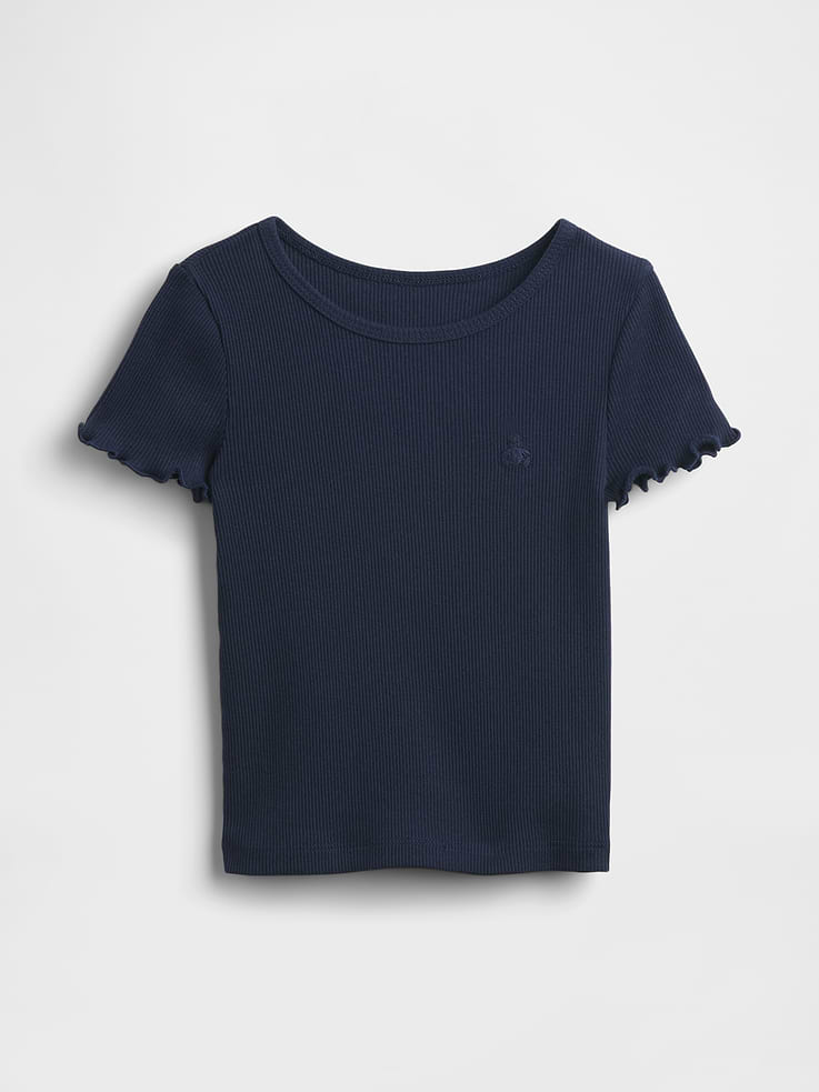 Image 1 of 2, Ours, yours (and their!) favorite 5-second outfit. Mix-and-match styles that go from preschool to playground in a snap. All in soft cotton., Soft cotton ribbed knit T-shirt., Crewneck., Short sleeves with lettuce trim., This product was made in a factory that invests in gender equality and women’s empowerment. Through RISE (Reimagining Industry to Support Equality) and Gap Inc.’s program P.A.C.E. (Personal Advancement & Career Enhancement), we support people who make our clothes to build the skills, knowledge, confidence, and resilience needed to advance in work and life. Learn more here ., Product #498076