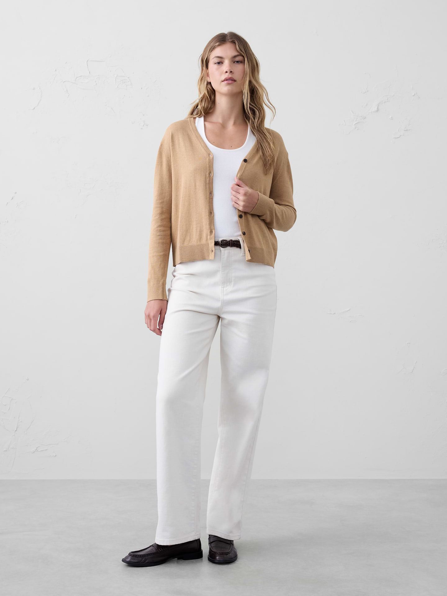 Image 1 of 7, Our Forever V-Neck Cardigan now features an updated neckline., V-neck. Long sleeves., Slight dropped shoulder., Button front closure., Ribbed arm cuffs and hem., Straight hem., Made exclusively for Banana Republic Factory., Product #480183