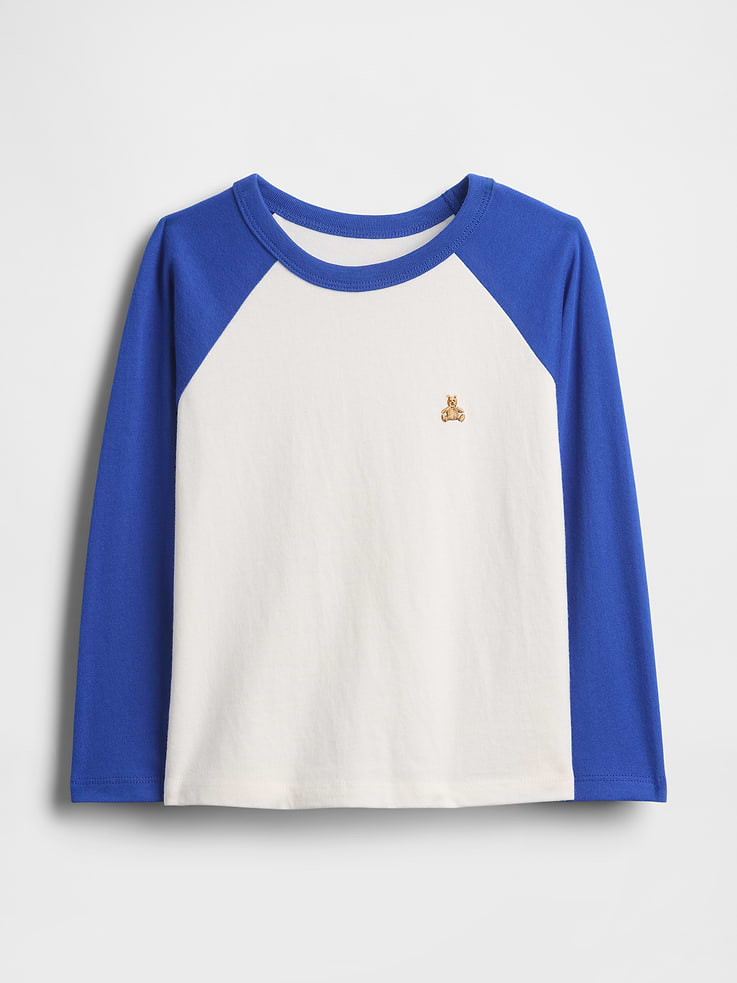 Image 1 of 2, Ours, yours (and their!) favorite 5-second outfit. Mix-and-match styles that go from preschool to playground in a snap. All in soft cotton., Soft cotton jersey T-shirt., Crewneck., Long sleeves., Certain styles have a patch pocket with embroidered Brannan Bear at chest., Certain styles have a colorblock raglan T-shirt design., Made with 100% Protocol cotton verified by the U.S. Cotton Trust Protocol, a program which works with farms committed to improving their environmental footprint by minimizing water usage and improving soil diversity (Claim No. 10127)., This product was made in a factory that invests in gender equity and women’s empowerment through RISE. Learn more at gapinc.com/equity ., Product #814270