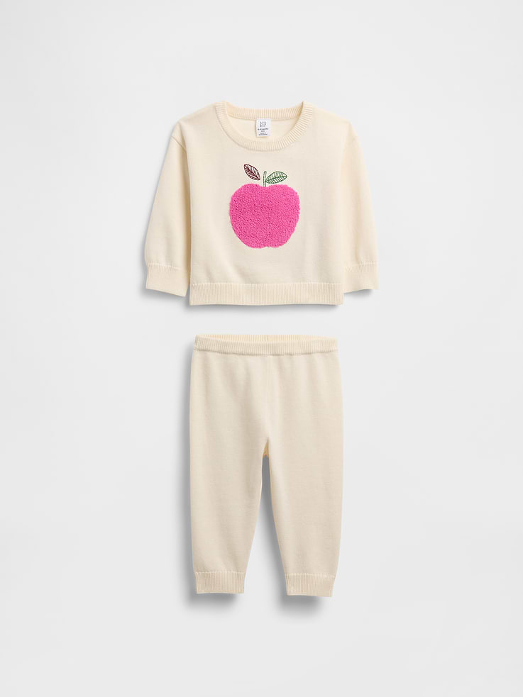 Image 1 of 3, Soft cotton knit top and pull-on pants outfit set., Crewneck., Long sleeves with banded cuffs., Assorted embroidered graphics at front., Ribbed hem., Elasticized waist at pull-on pants., Banded cuffs., This product was made in a factory that invests in gender equity and women’s empowerment through RISE. Learn more at gapinc.com/equity., Product #816497