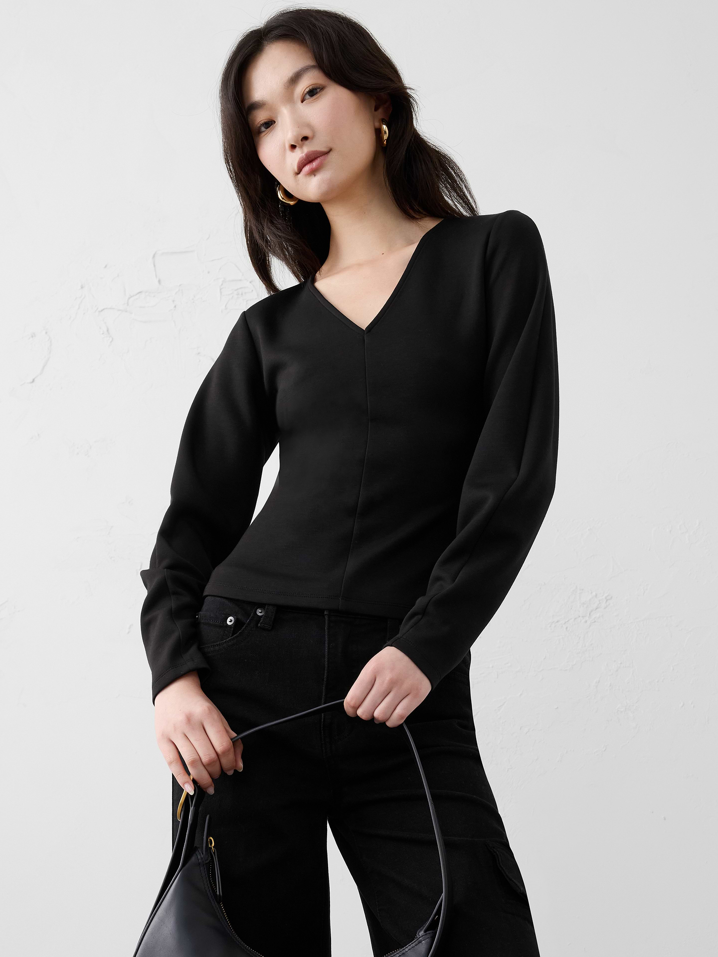 Image 1 of 1, SUSTAINABILITY: Made with 41% recycled polyester., V-neck. Balloon long sleeves., Features seamed details on front and back., Straight hem., Made exclusively for Banana Republic Factory., Product #809892