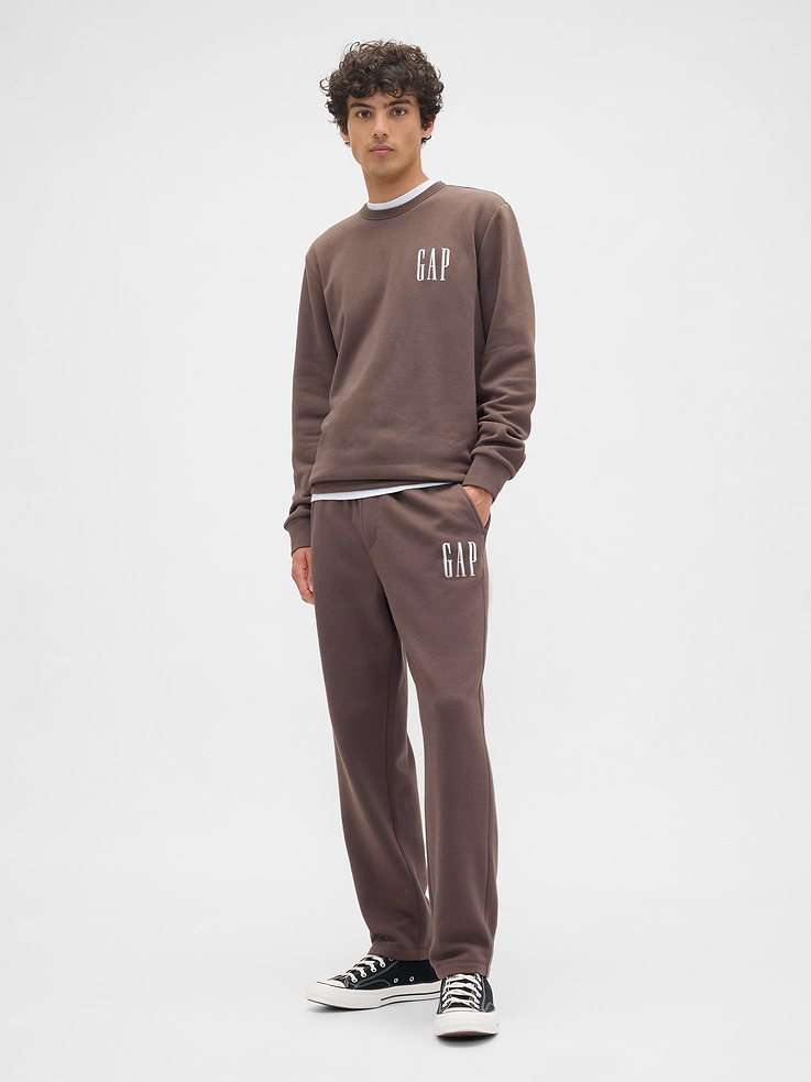 Image 1 of 4, Soft, comfy fleece., Drawcord ties at elasticized waistband., Front slant pockets., Gap logo at leg., This product was made in a factory that invests in gender equity and women’s empowerment through RISE. Learn more at, Product #672980