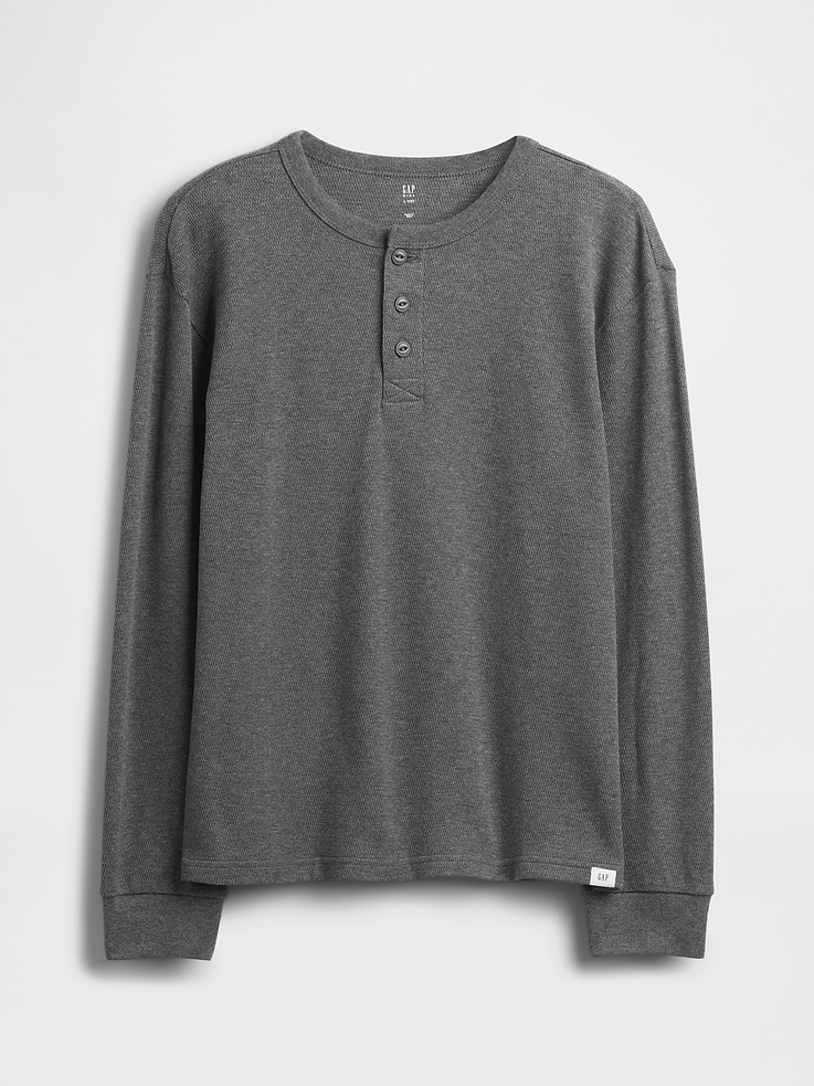 Image 1 of 2, Soft cotton relaxed T-shirt., Crewneck, Henley button placket., Long sleeves with banded cuffs., This product was made in a factory that invests in gender equity and women’s empowerment through RISE. Learn more at gapinc.com/equity., Product #827268