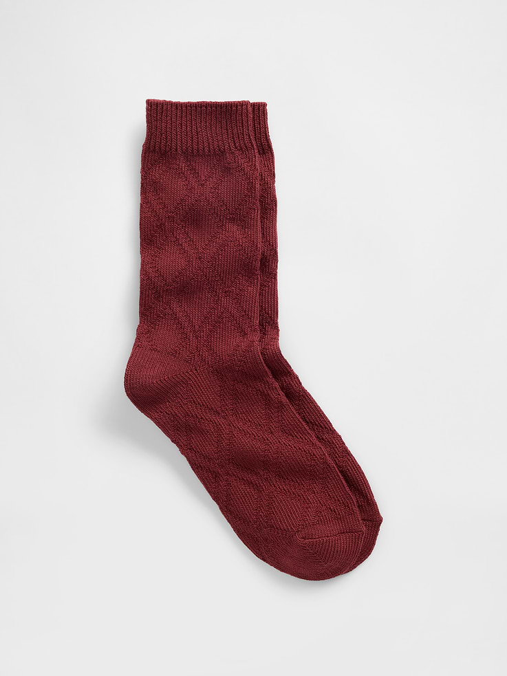 Image 1 of 1, Soft, stretch cable-knit crew socks., Ribbed top., Reinforced toe and heel., This product was made in a factory that invests in gender equity and women’s empowerment through RISE. Learn more at gapinc.com/equity., Product #761368