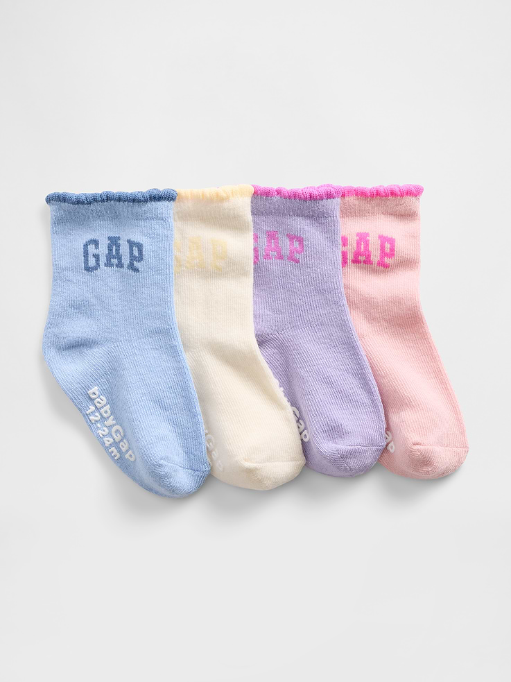 Image 1 of 1, Soft, stretch knit quarter crew socks., Ruffle detail at ribbed top., Reinforced toe and heel., Gap arch logo at side., Made with 10% recycled polyester. Compared to virgin materials, using recycled materials helps reduce resource use and waste., Product #821249