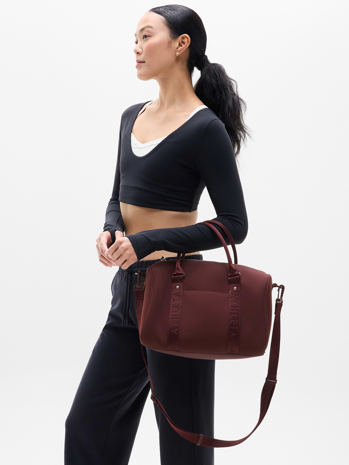 Image 1 of 5, FOR: Stowing stuff for weekly workouts or weekend getaways, FEEL: Peak-sleek neoprene bounces wear, tear, and water away effortlessly, FAVE: Comfort-first, wide strap is sturdily stitched in place to support heavier loads, Ribbing provides extra comfort, Product #767896