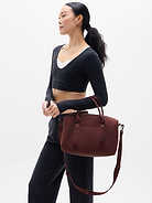 Image 1 of 5, FOR: Stowing stuff for weekly workouts or weekend getaways, FEEL: Peak-sleek neoprene bounces wear, tear, and water away effortlessly, FAVE: Comfort-first, wide strap is sturdily stitched in place to support heavier loads, Ribbing provides extra comfort, Product #767896