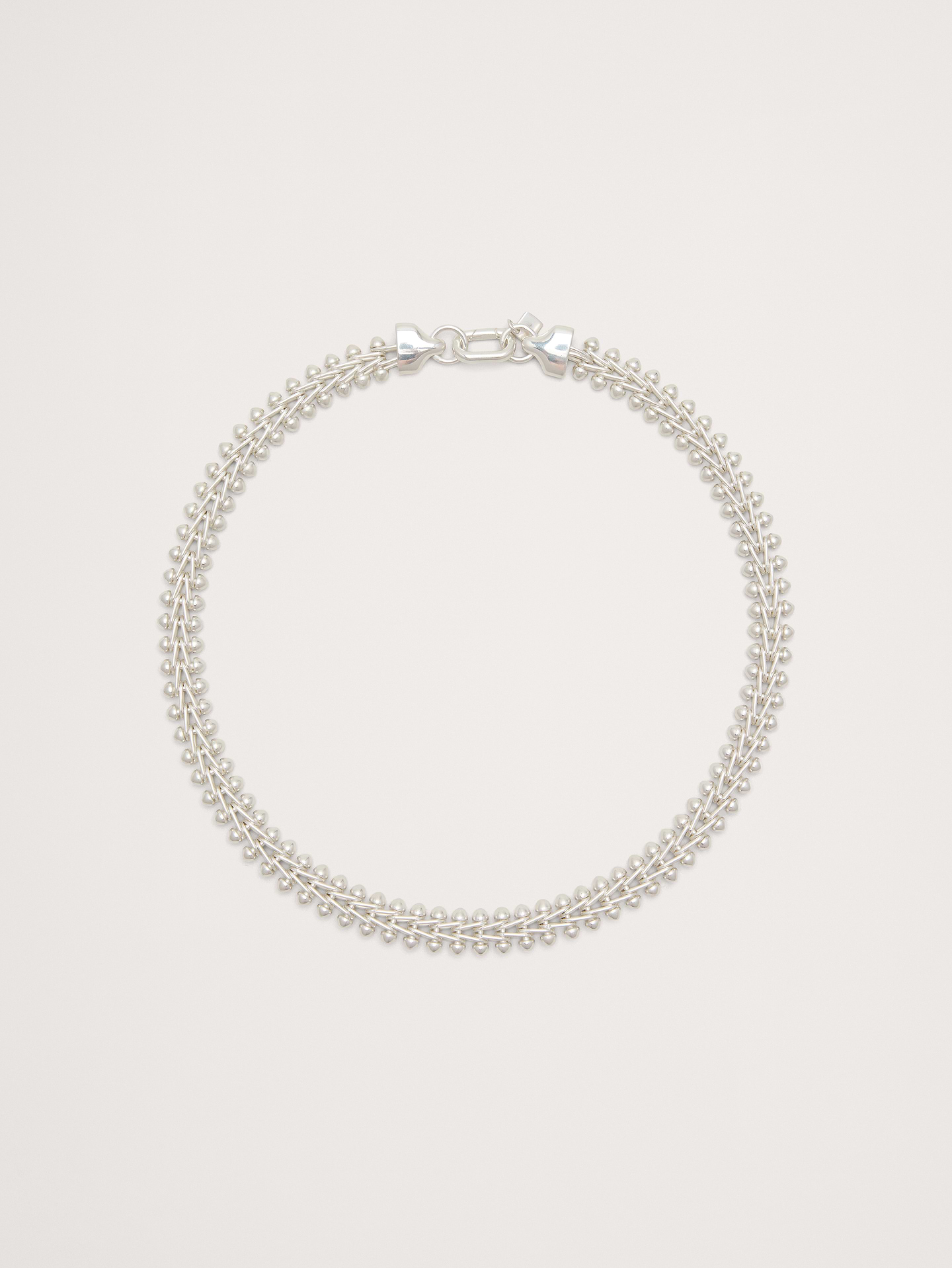 Image 1 of 4, A timeless and understated take on the classic chain-link necklace, that's anything but basic with a woven herringbone links and punctuated with ball tips., 14k-gold or 999-silver plated brass., Oval clasp., Product #826421