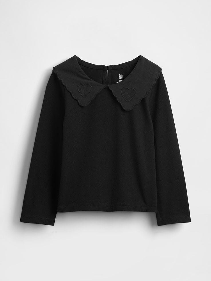 Image 1 of 3, Soft cotton jersey top., Scalloped collar with embroidered hearts at front and back., Keyhole button closure at back., Long sleeves., This product was made in a factory that invests in gender equity and women’s empowerment through RISE. Learn more at gapinc.com/equity., Product #816552