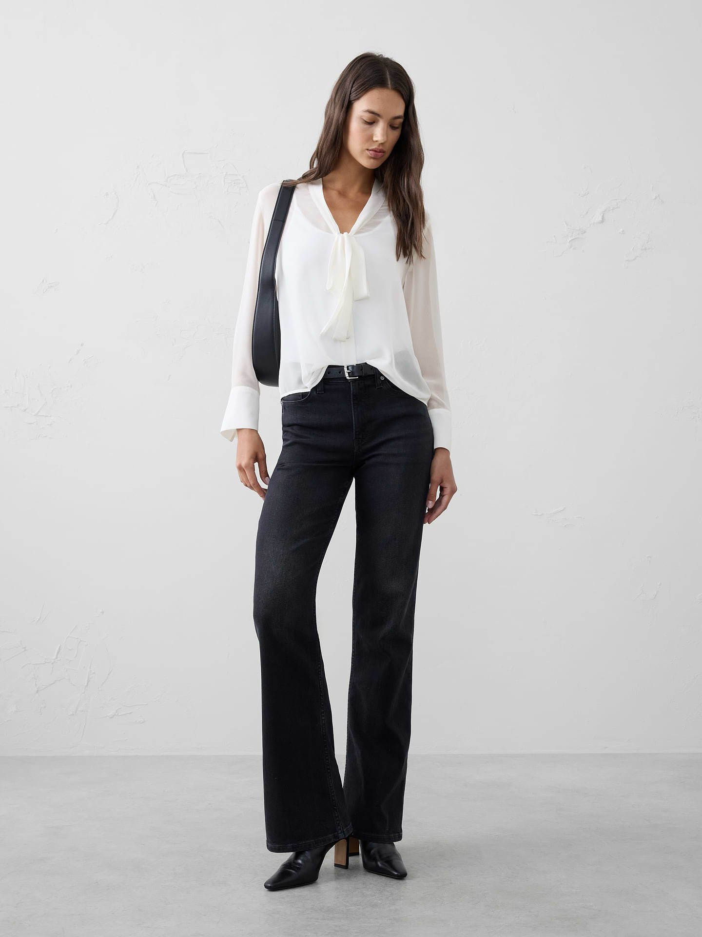 Image 1 of 4, Lightweight chiffon with a subtly sheer finish—perfect for layering over a tank. Finished with a feminine tie-neck detail for an elevated touch., Band collar with v-neck. Long sleeves with buttoned cuffs., Button front closure., Back yoke with box pleat., Curved hem., Made exclusively for Banana Republic Factory., Product #813645