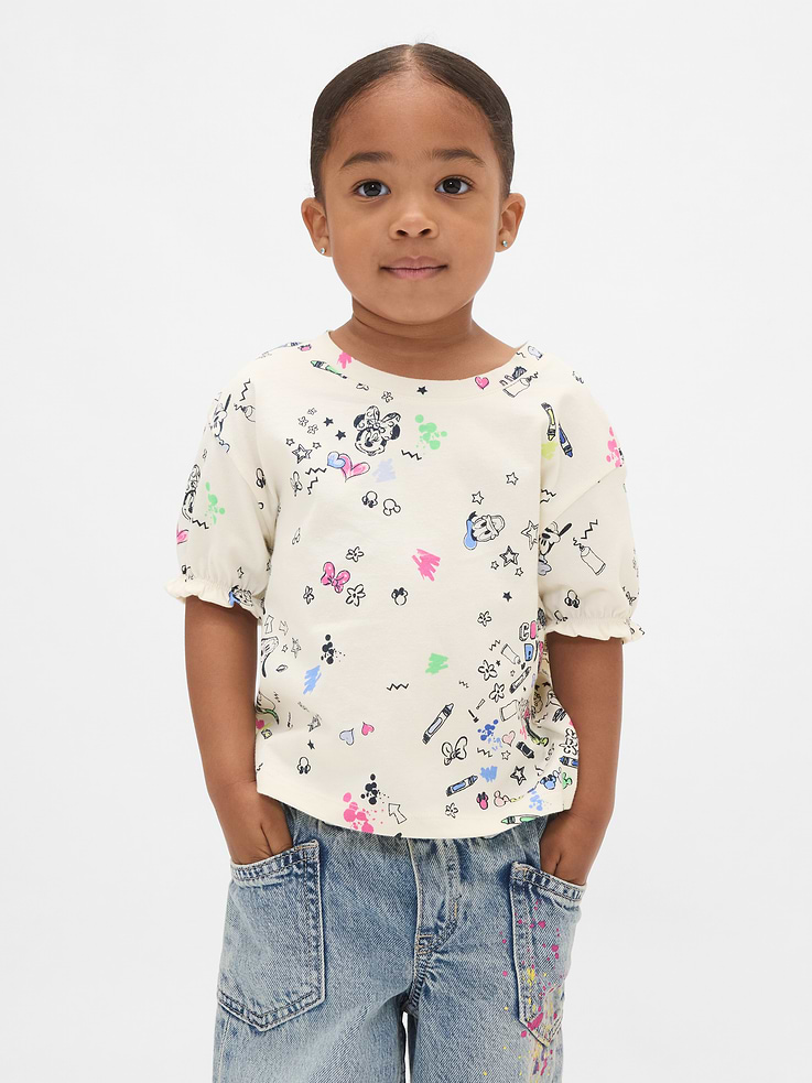 Image 1 of 3, Characters for your little characters. Making every day more special., Soft cotton jersey T-shirt., Round neck., Short sleeves with elasticized cuffs and ruffle trim., Assorted Disney character graphics and prints., This product was made in a factory that invests in gender equity and women’s empowerment through RISE. Learn more at gapinc.com/equity., Product #815994