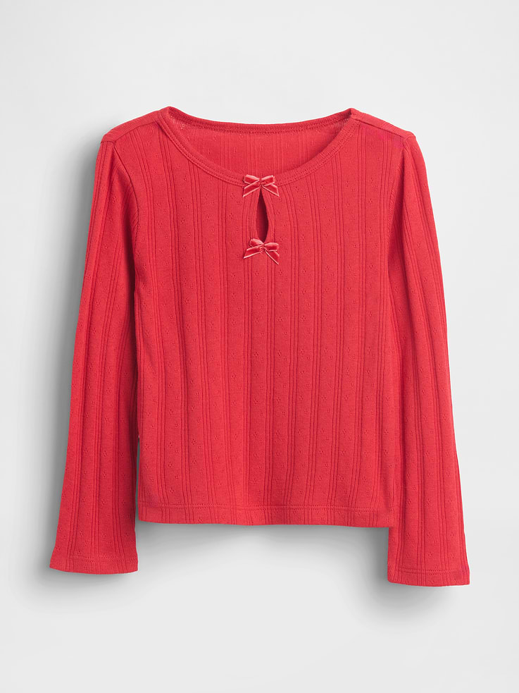 Image 1 of 3, Soft, ribbed cotton pointelle knit top, Round neck with velvet bows and keyhole opening details at front., Long sleeves., This product was made in a factory that invests in gender equity and women’s empowerment through RISE. Learn more at gapinc.com/equity., Product #842894