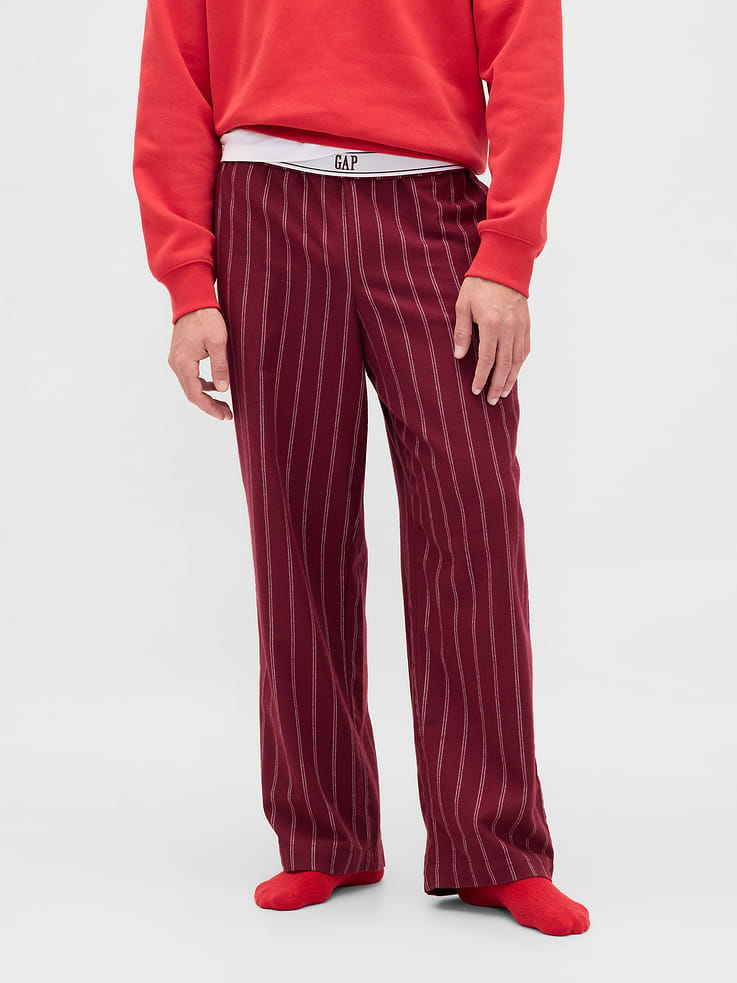 Image 1 of 9, Our softest flannel ever. Double washed for extra softness. Fully relaxed for easy comfort. Universally perfect for absolutely everyone., Supersoft cotton flannel pajama pants., Elasticized waist. Certain styles have drawcords or foldover band with Gap logo at front., Assorted colors, graphics, and prints., This product was made in a factory that invests in gender equity and women’s empowerment through RISE. Learn more at gapinc.com/equity ., Product #813289