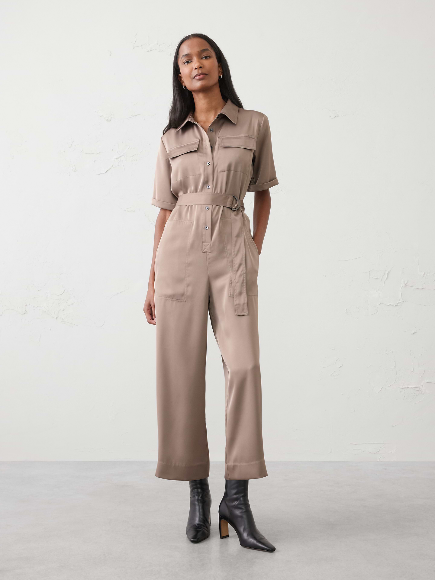Image 1 of 4, A standout favorite, this satin jumpsuit is crafted from a thick, lustrous fabric with a beautiful sheen. Designed with a flattering silhouette and thoughtful details, it’s made to suit every body., Stand collar. Short sleeves., Drop shoulders., Button front closure., Hand pockets. Chest pockets. Back pockets., Back yoke., Fabric belt included., Made exclusively for Banana Republic Factory., Product #844346